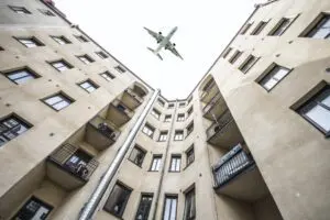 Jet flying over offices