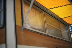 Old windows in static caravan