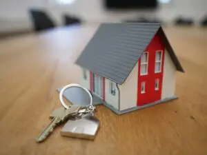  Toy house and keys on table