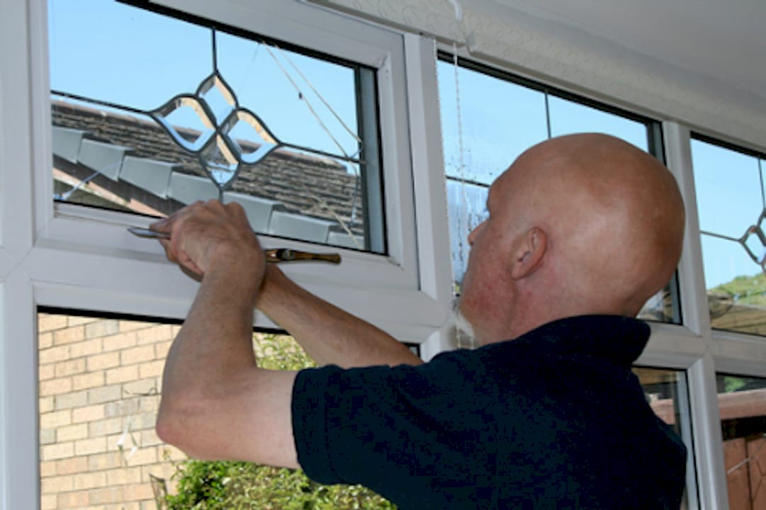 Cloudy2Clear installer repairing a window.