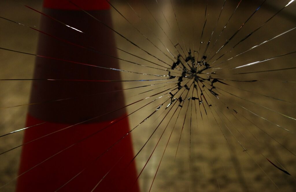 A window with a crack in the glass pane