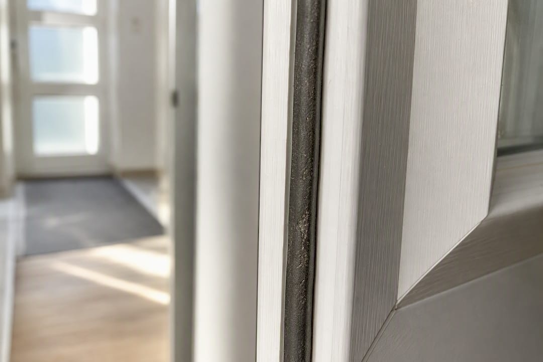 Weatherstrip seal on uPVC door frame