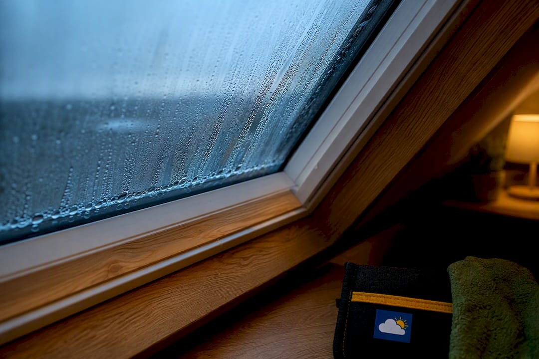 Condensation beads on roof window glazing