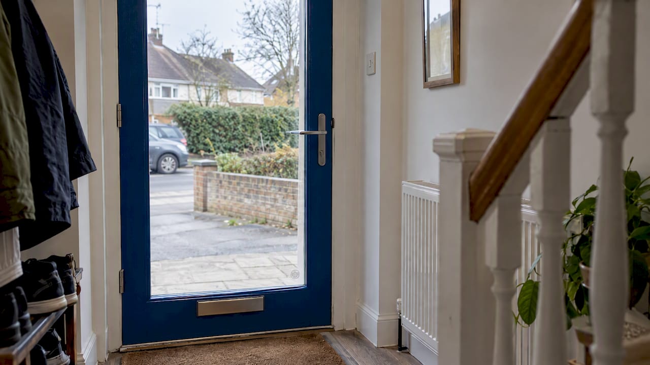 Toughened glass in a blue-framed entrance door