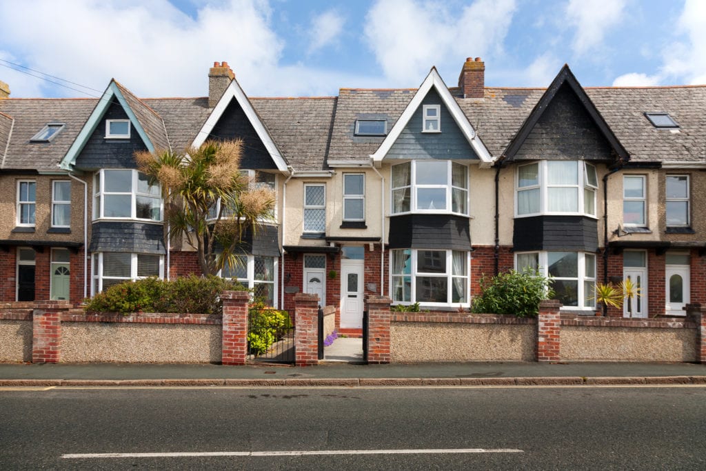 English street of terraced houses, without parked cars.